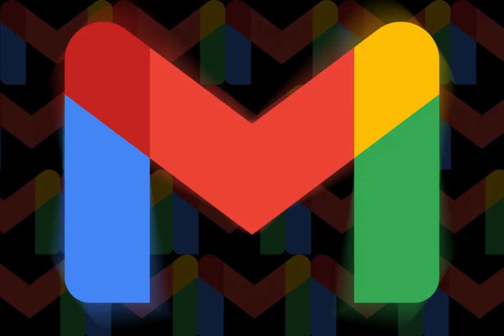 Vibrant Gmail wallpaper with large colorful M logo on dark patterned background for desktop