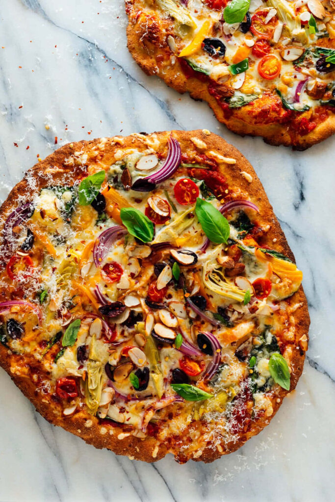 Vibrant Gourmet Pizza with Fresh Veggies & Herbs - Wallpaper Background