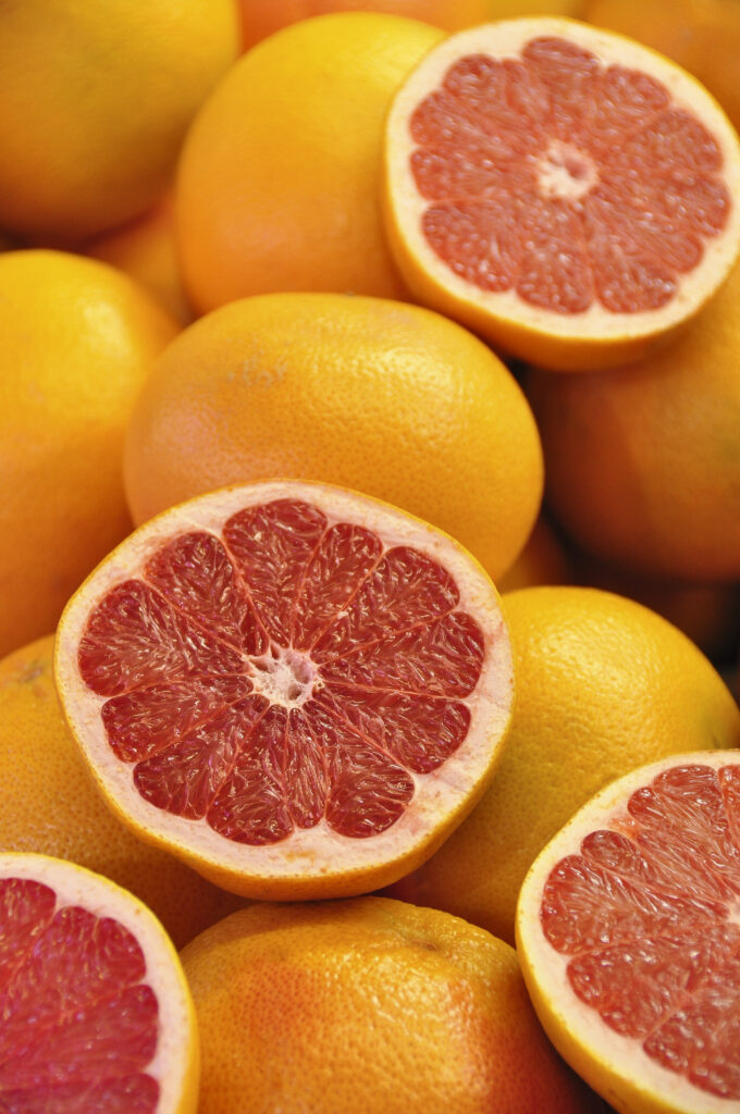 Vibrant Grapefruit Wallpaper: Bright Yellow Rinds & Juicy Red Pulp