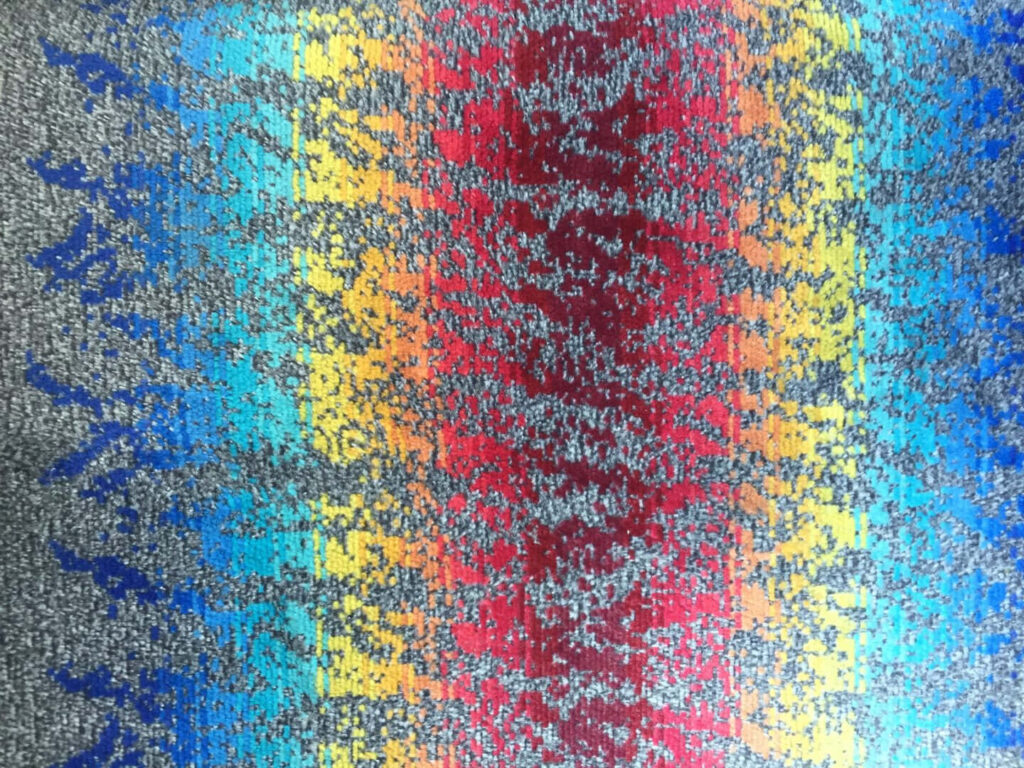 Vibrant Rainbow Textured Fabric Wallpaper Background in Gray