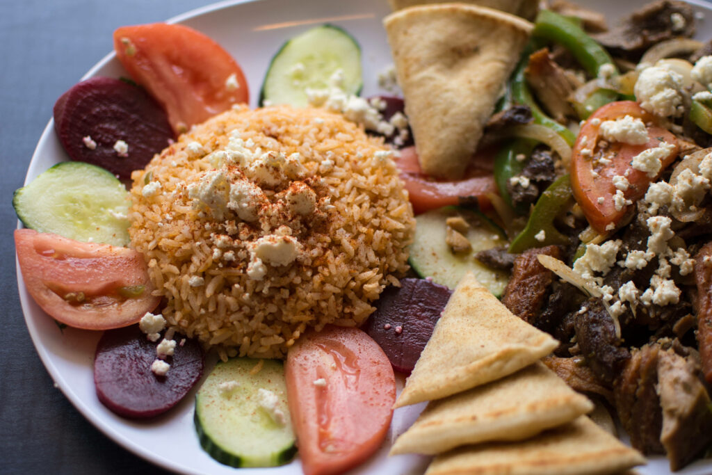 Authentic Greek Food Wallpaper: Rice, Veggies, Feta & Pita Delight