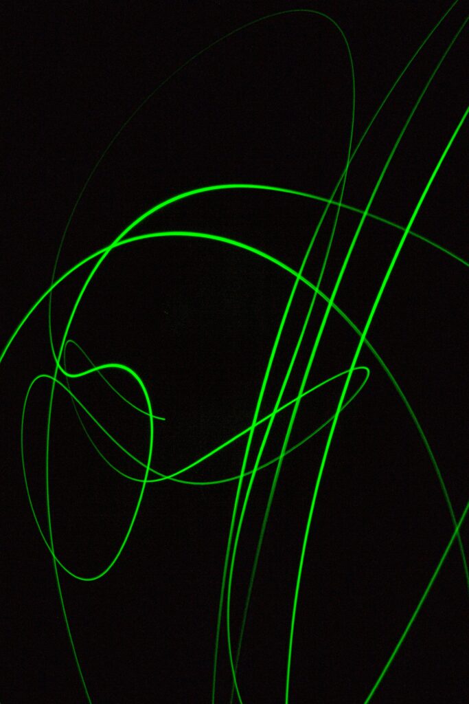 Dynamic Abstract Green Line Wallpaper on Deep Black Background