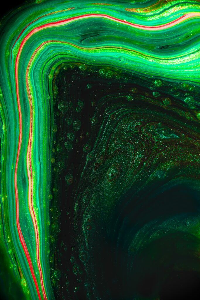 Vibrant Green Abstract Macro Wallpaper with Flowing Liquid Textures