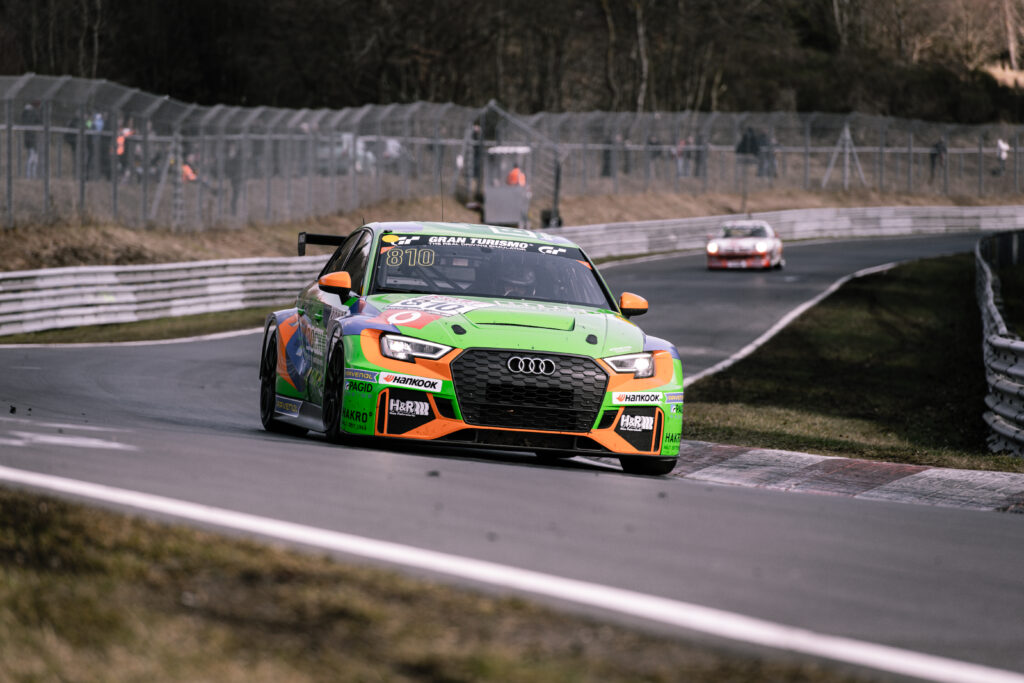 Vibrant Green Audi RS3 Racetrack Wallpaper with Aerodynamic Flair