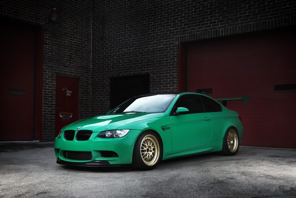 Vibrant Green BMW M3 E92 Wallpaper: Urban Style & Bold Design