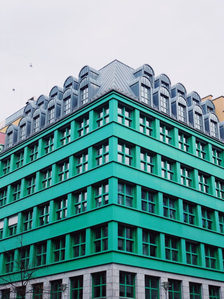 Vibrant Green Building Wallpaper: Modern & Classic Architecture