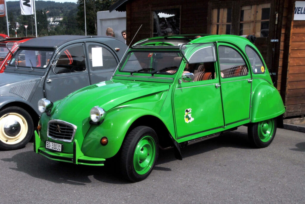 Vibrant Green Citroën 2CV: Iconic Retro Charm Wallpaper Background