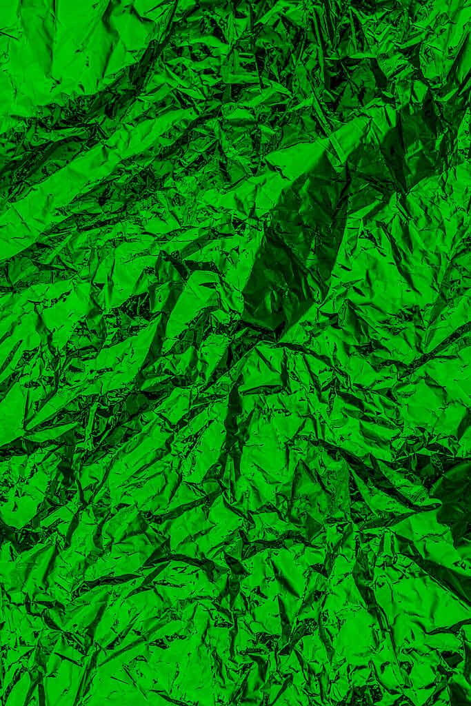 Vibrant Crumpled Green Foil Texture: Dynamic Wallpaper Background