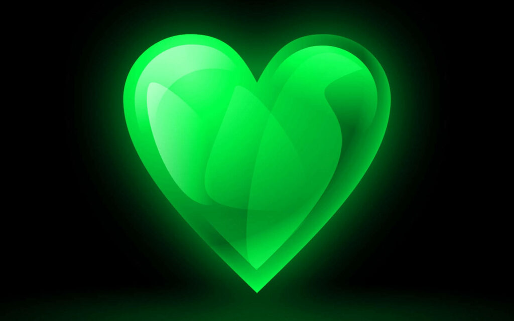 Vibrant Glowing Green Heart Wallpaper on Dark Background