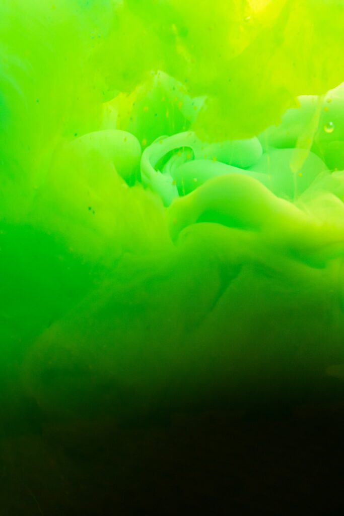 Dynamic Green Ink Wallpaper: Abstract Liquid Patterns & Textures