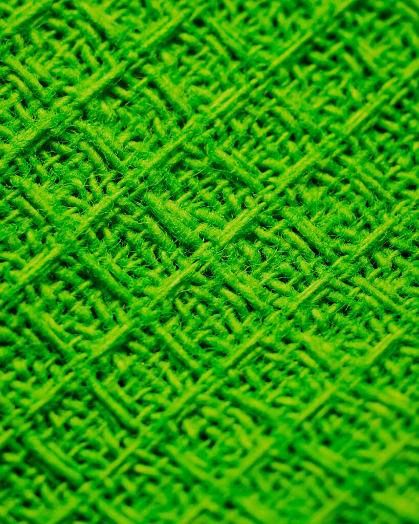 Vibrant Green Knitted Fabric Texture for Stunning Wallpaper Background