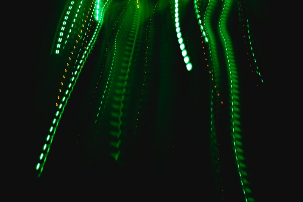 Dynamic Green Laser Wallpaper: Modern Background with Motion