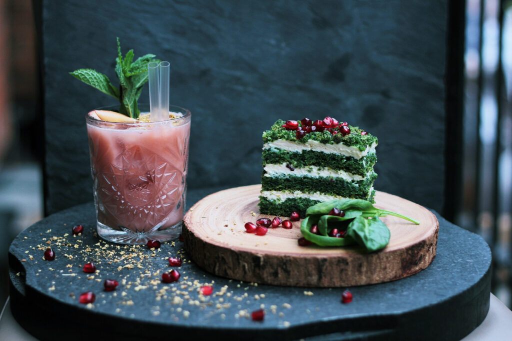 Green Layered Cake & Drink Wallpaper: Rustic Charm with Pomegranate
