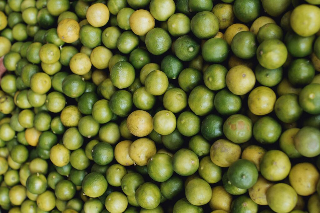 Fresh Green Limes Wallpaper: Vibrant Citrus Texture Background