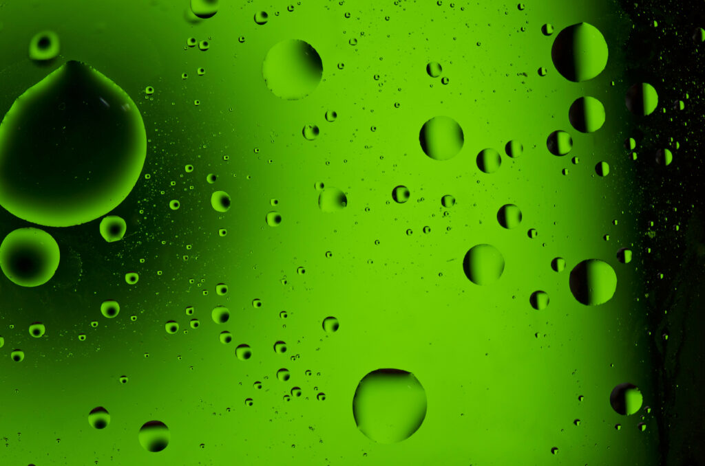Vibrant Macro Wallpaper: Green Liquid with Mesmerizing Oil Bubbles