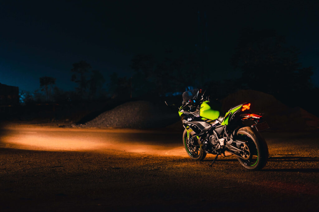 Vibrant Green Motorcycle Spotlight: Adventure Wallpaper Background