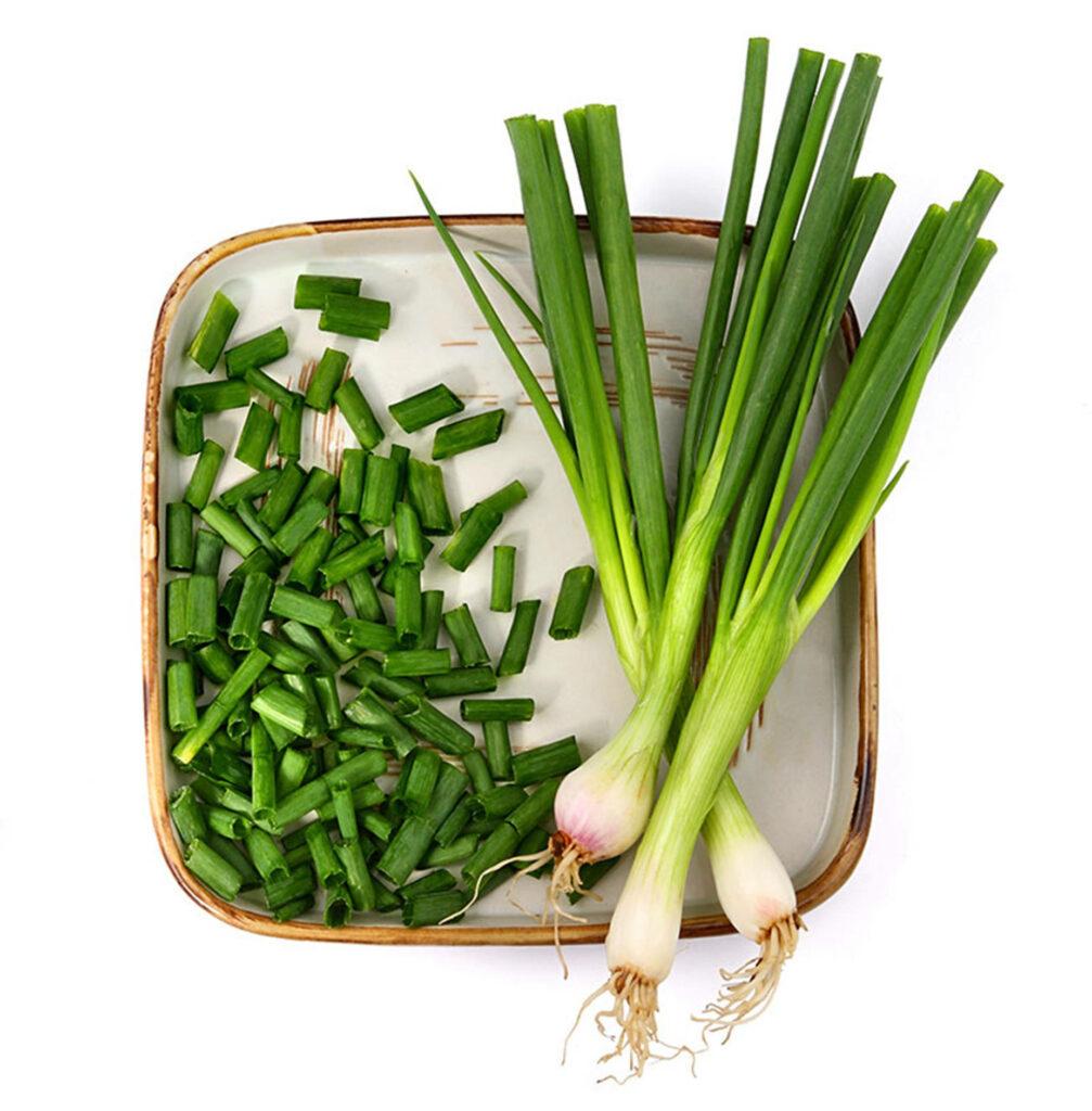 Vibrant Green Onions Flat Lay: Fresh & Chopped Wallpaper Background