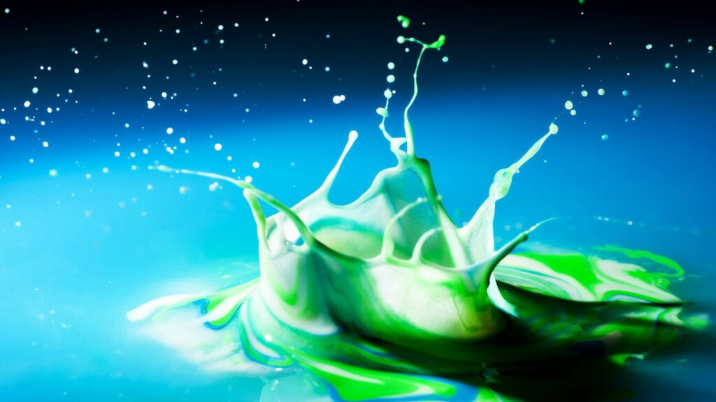 Dynamic Green Paint Splash Wallpaper on Blue Background