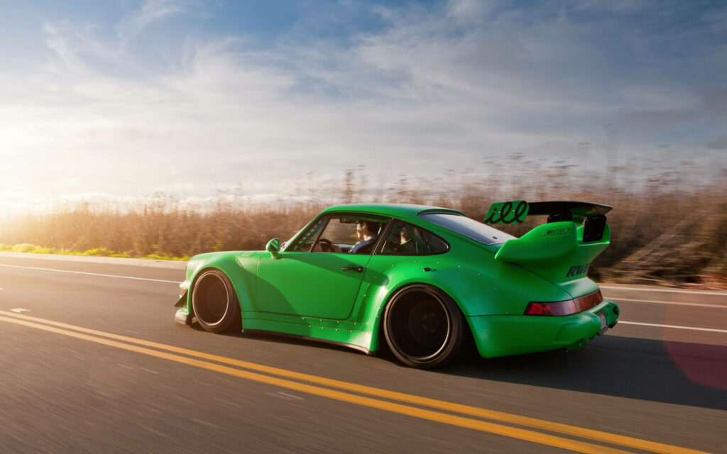 Vibrant green RWB Porsche 911 speeding on open road under bright sky 4k wallpaper background
