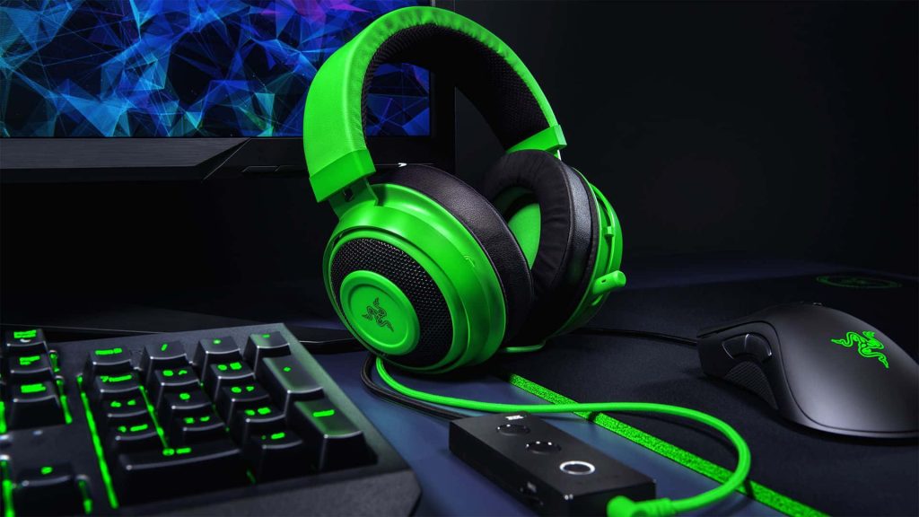 Vibrant green black Razer Kraken headset with Razer mouse keyboard gaming desktop wallpaper