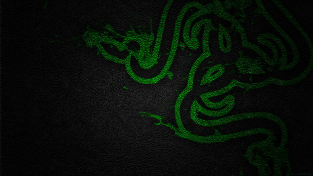 Vibrant Green Razer PC Logo Shines on Sleek Black Textured Surface Wallpaper