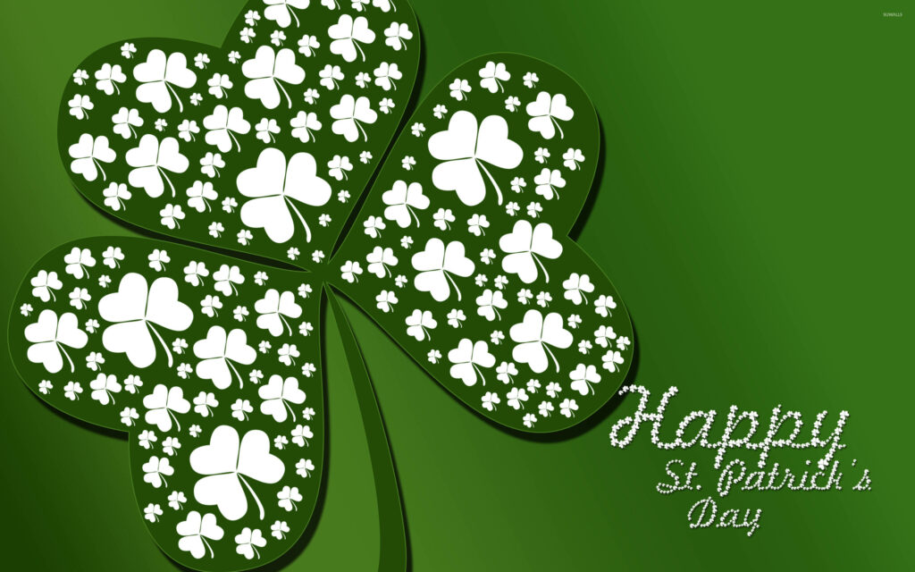 Vibrant green Saint Patricks Day wallpaper with large clover filled with white clover patterns