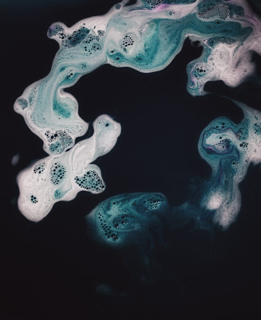 Vibrant Green and White Swirling Liquid Macro Wallpaper Background