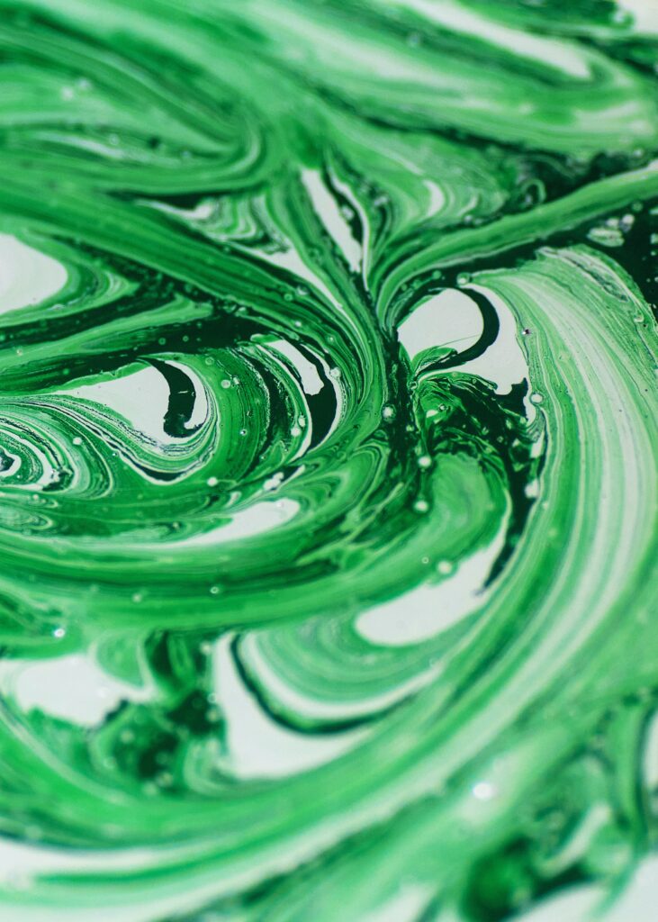 Vibrant Green and White Abstract Wallpaper: Fluid Art Background
