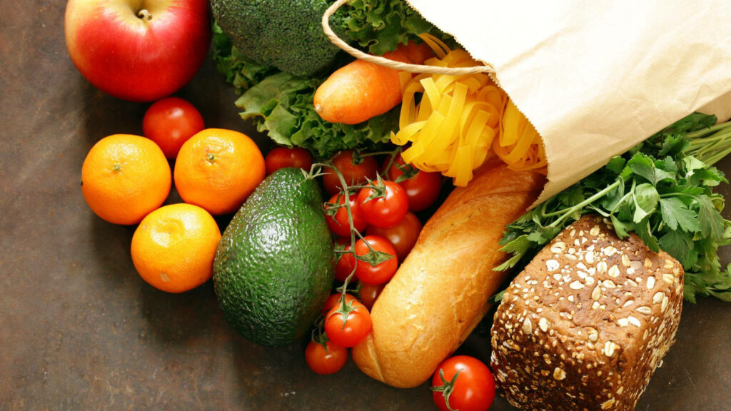 Fresh Grocery Wallpaper: Vibrant Fruits, Veggies, and Bread Display