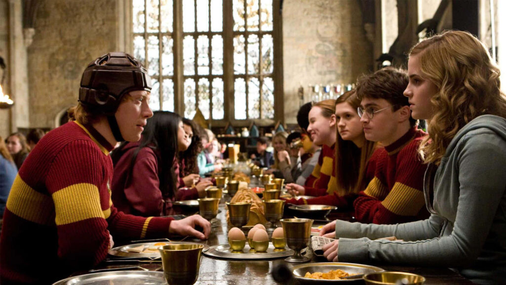 Lively Hogwarts Gryffindor Table Wallpaper - Magical Great Hall Scene