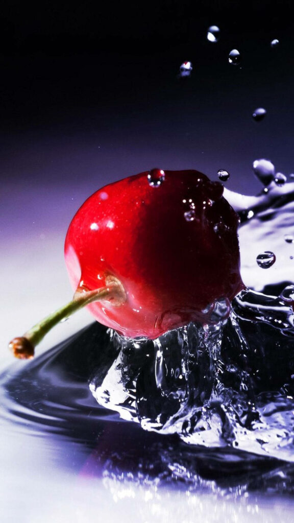 HTC red cherry wallpaper with vibrant splash and water droplets on dark sleek background