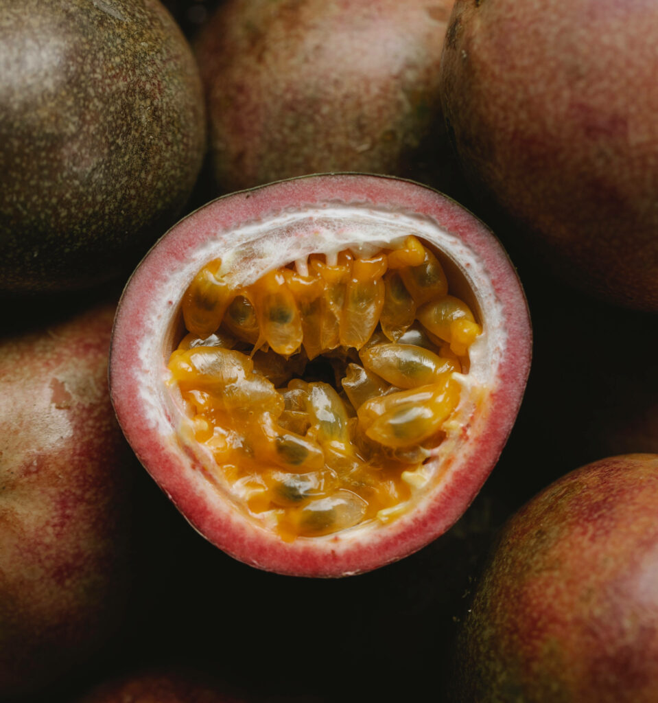 Vibrant Passion Fruit Close-Up Wallpaper: Ripe Pulp & Seeds