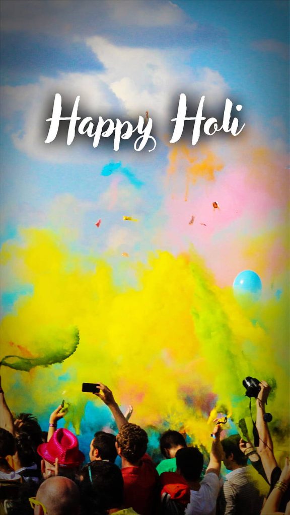 Happy Holi vibrant festival scene with colorful gulal powder and joyous crowd celebrating outdoors Wallpaper