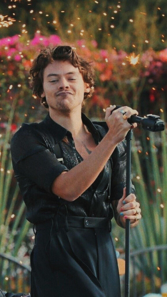 Harry Styles Microphone Wallpaper: Colorful iPhone Background with Flowers