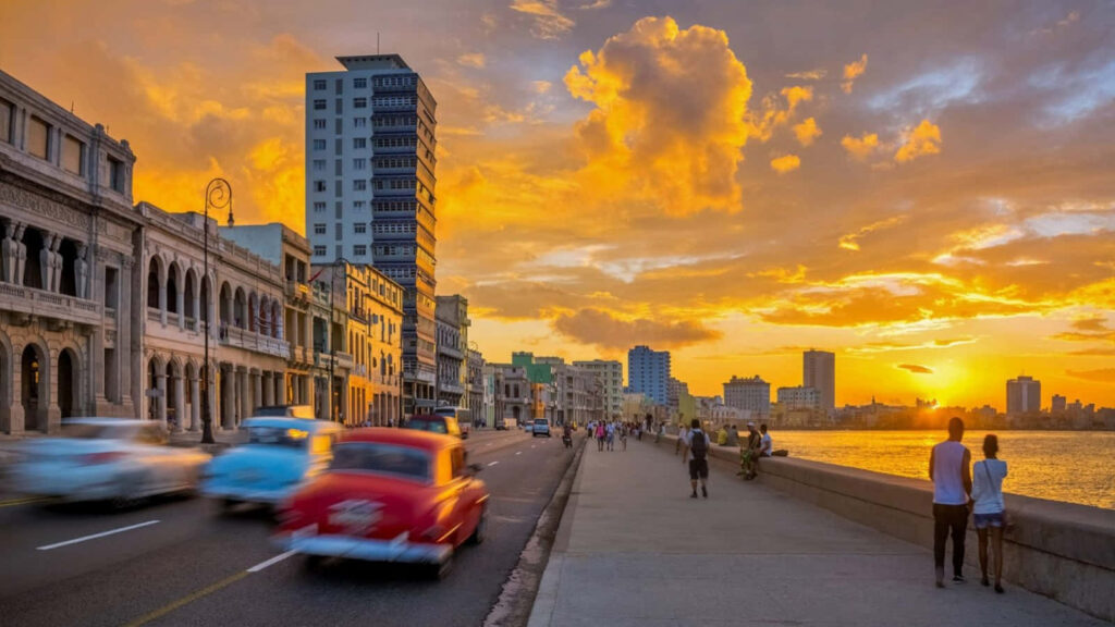 Vibrant Havana Sunset: Golden Hues Over Streets & Coastline Wallpaper
