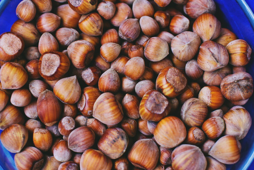 Vibrant Nut Wallpaper: Close-Up of Hazelnuts and Walnuts