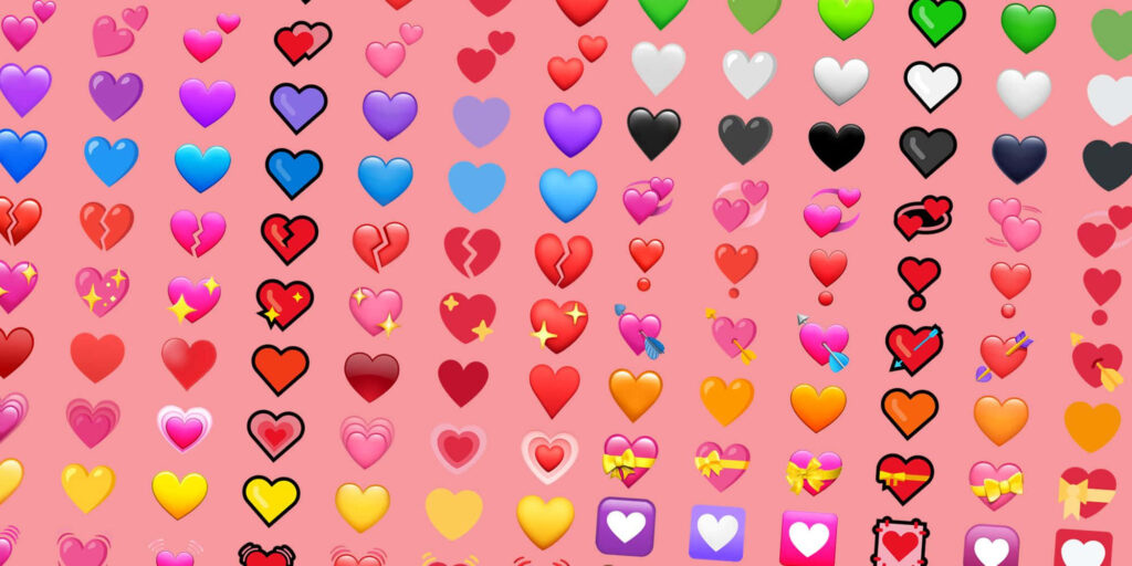 Vibrant Colorful Heart Icons Wallpaper on Soft Pink Background