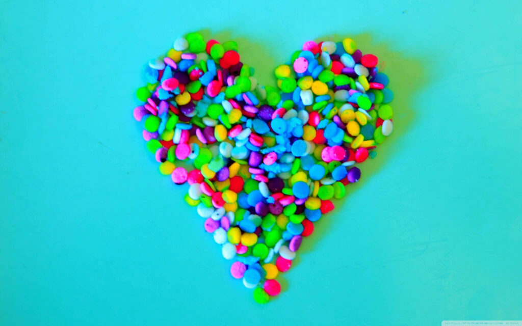 Colorful Heart Confetti Design on Bright Blue Wallpaper Background