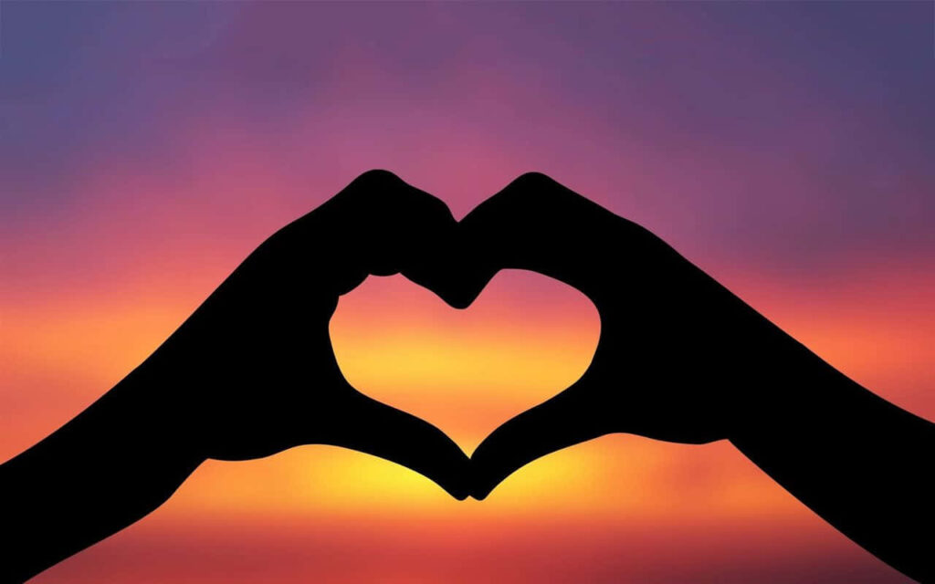 Heart-Shaped Hands Wallpaper: Love & Connection at Sunset Gradient