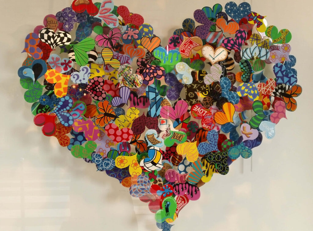 Vibrant Heart-Shaped Wallpaper Art on Rustic Wooden Background