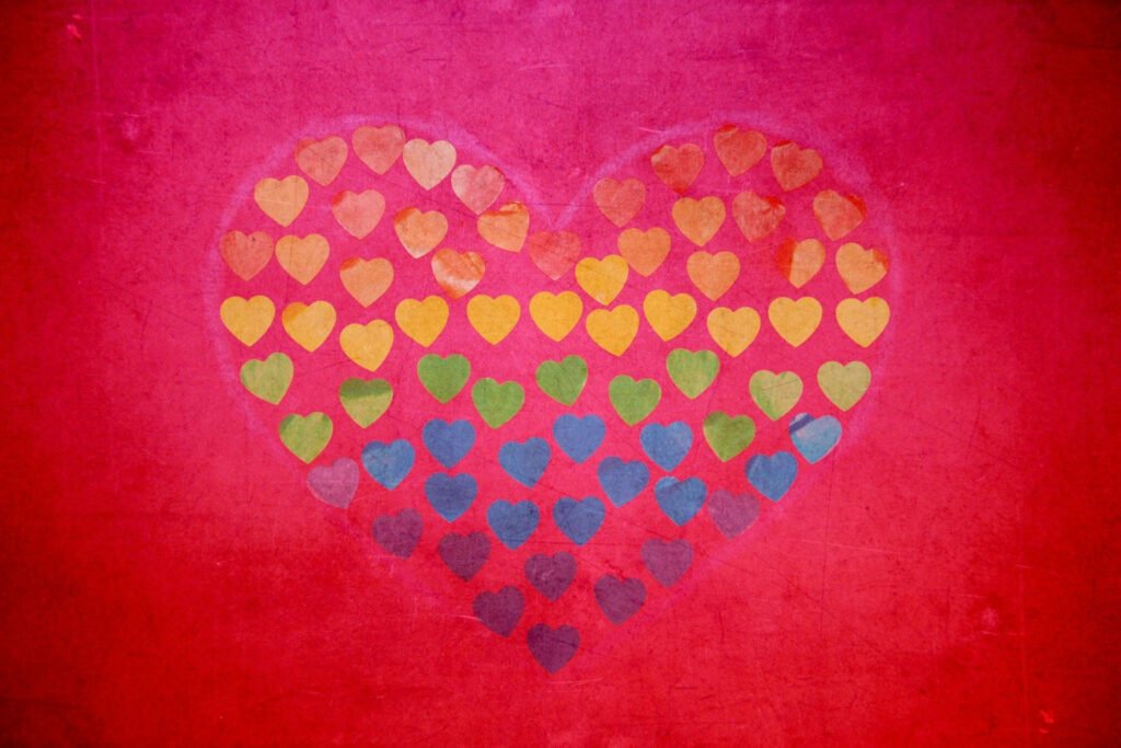 Vibrant Heart Wallpaper: Colorful Design on Red Background
