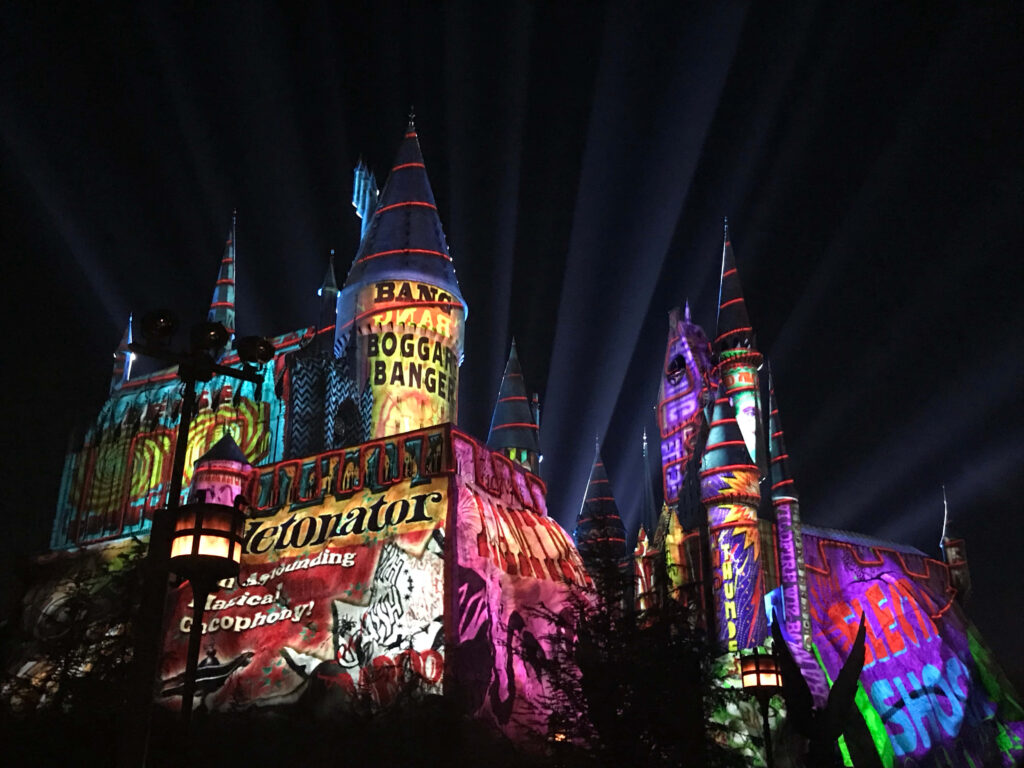 Magical Castle Lights: Vibrant Holiday Wallpaper Background