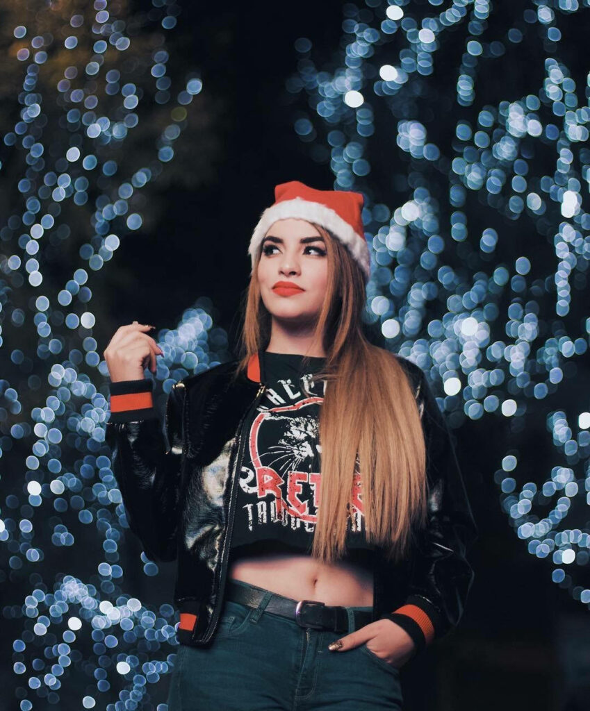 Festive Holiday Wallpaper: Santa Hat, Shiny Jacket & Christmas Lights