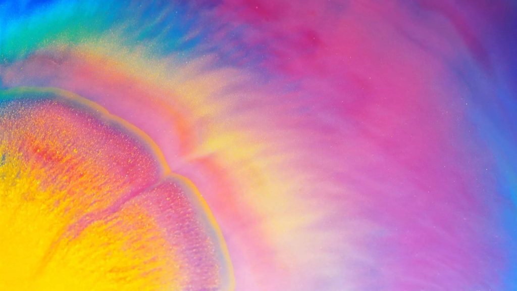 Vibrant holographic abstract wallpaper with swirling yellow pink and deep blue iridescent gradients