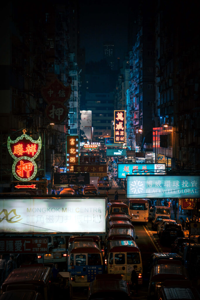Vibrant Hong Kong Night Scene: Neon Signs & Bustling Streets Wallpaper