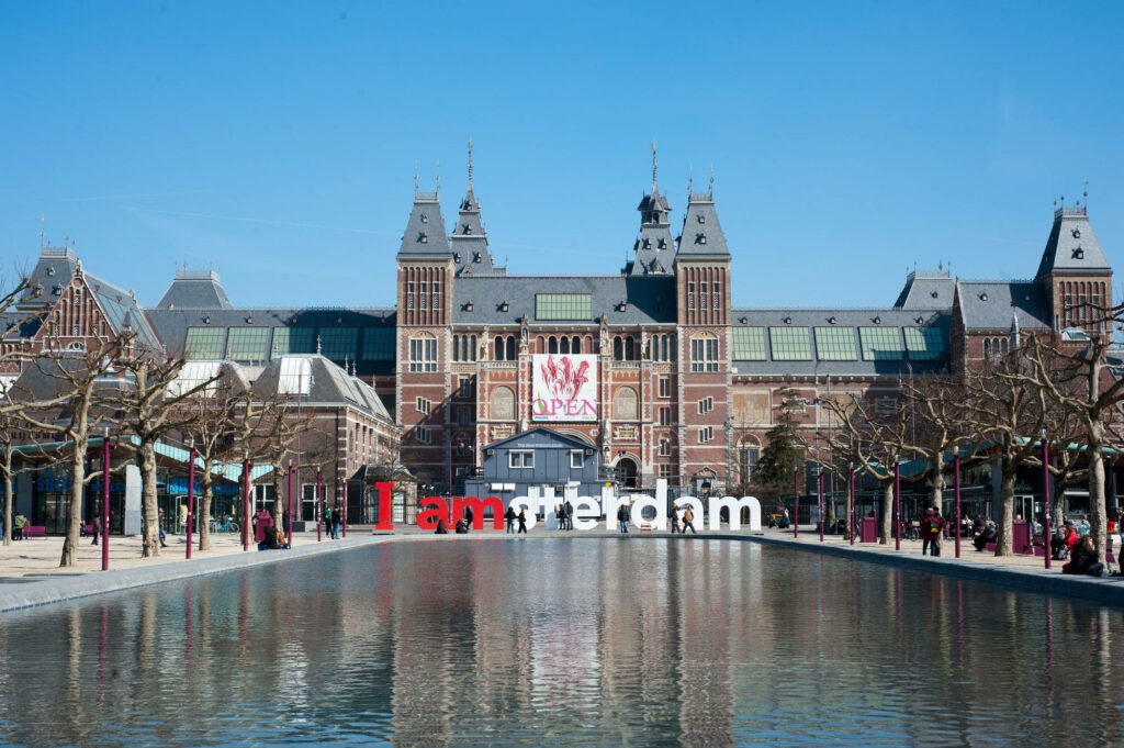 Vibrant Wallpaper: I Am Amsterdam Sculpture & Rijksmuseum Reflection