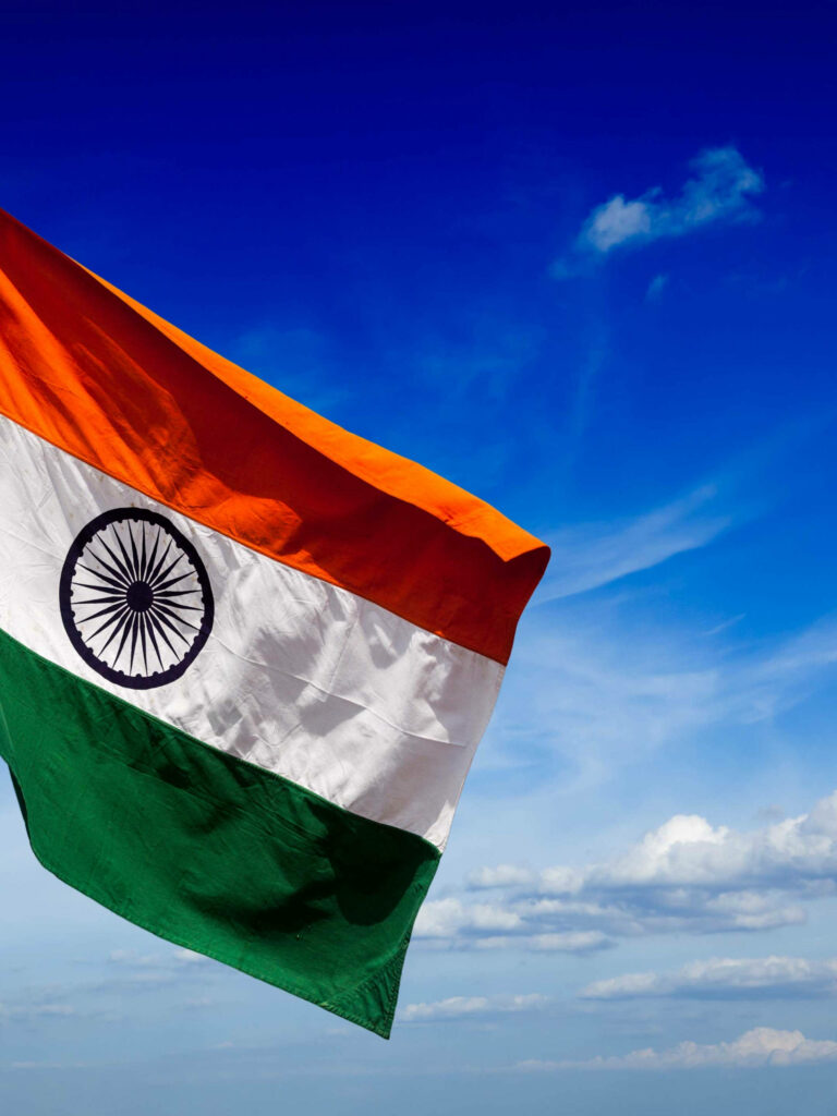Vibrant Indian Flag Wallpaper Against Clear Blue Sky - Unity & Pride