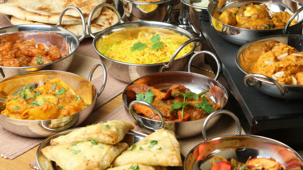 Vibrant Indian Food Wallpaper: Curries, Rice & Samosas Delight