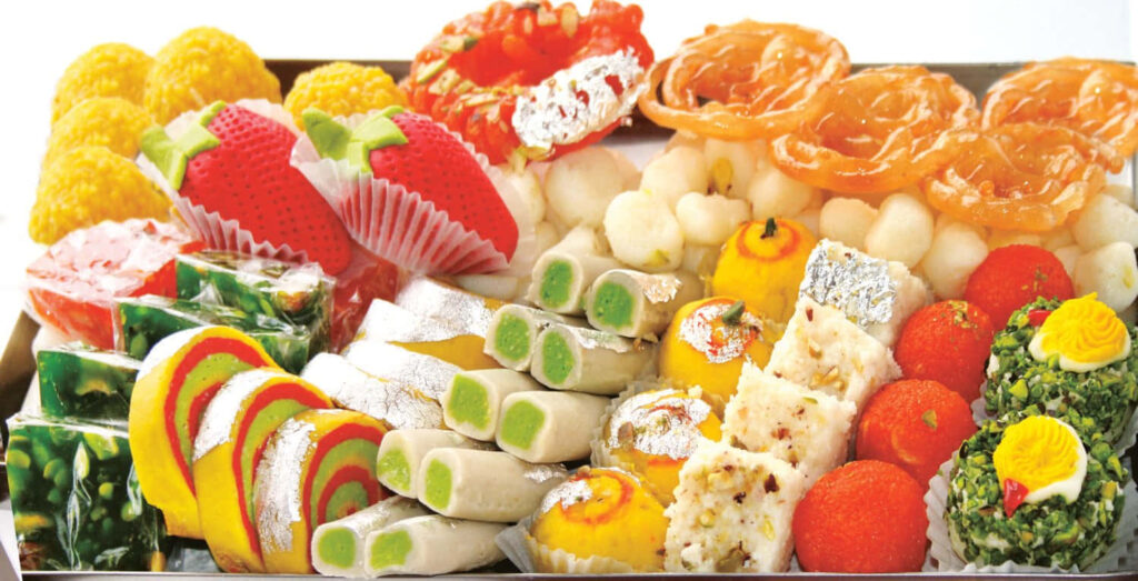 Vibrant Indian Sweets Wallpaper: Colorful Delicacies & Intricate Designs