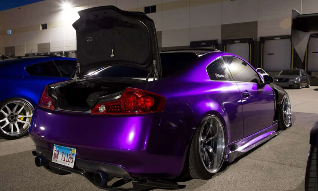 Vibrant Infiniti G35 Wallpaper: Sleek Purple Car in Urban Setting